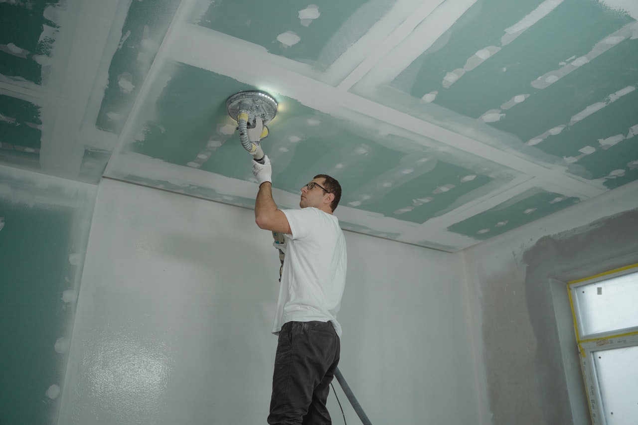 person polishing the ceiling