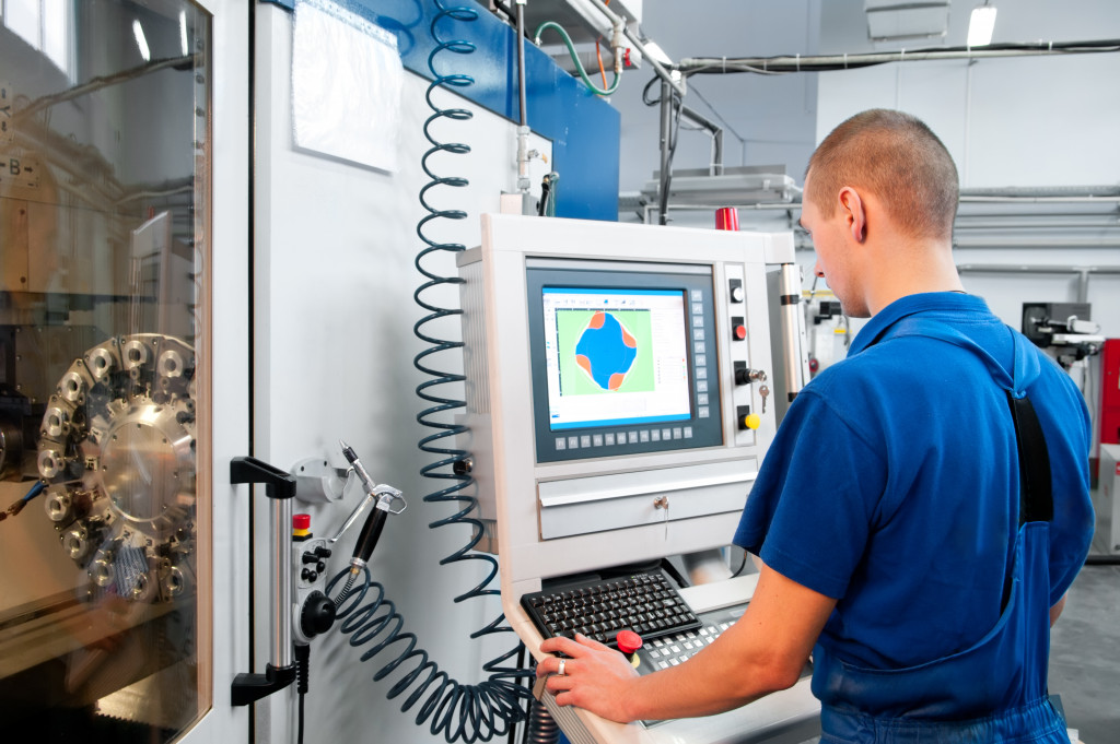 man looking at digital data for machine performance